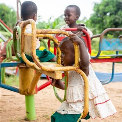 Orphans playing at the playground at our orphanage project in Uganda.