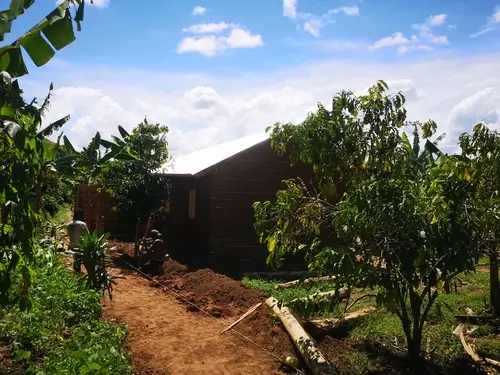 Building the house for the farm project in Uganda.